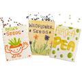 Three seed packets labeled 'Bella's Seeds', 'Wildflower Seeds', and 'Alaska Pea' on a white background.