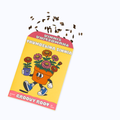 A tilted yellow seed packet labeled 'Groovy Root' with a cartoon flower pot character and colorful flowers, with several brown seeds scattered above it on a light gray background.