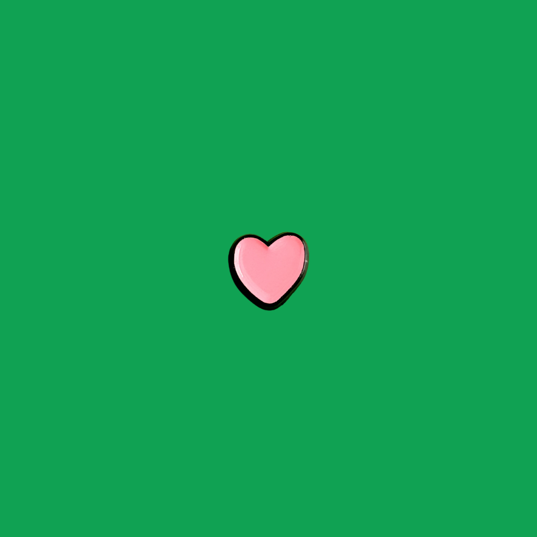 Pink heart shape on a green background