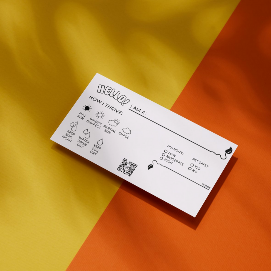 White business card with plant care options to fill in like sunlight, water and humidity needs. An option to select for pet safety and a small corner to write in notes.